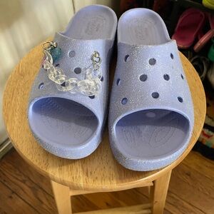 Sparking Crocs Purple Slide Sandals with Butterfly Charm Jibbitz Chain.